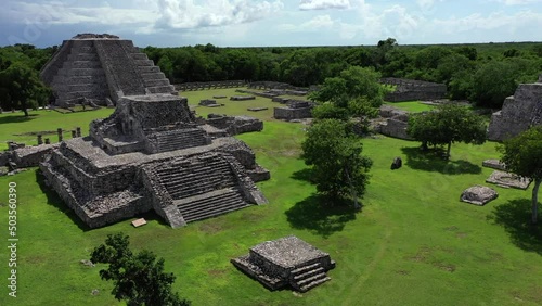 Aerial drone footage, flying around and circling the stone ruins of an ancient latin American tribe who built the city.  The pyramid being the biggest structure of the city.