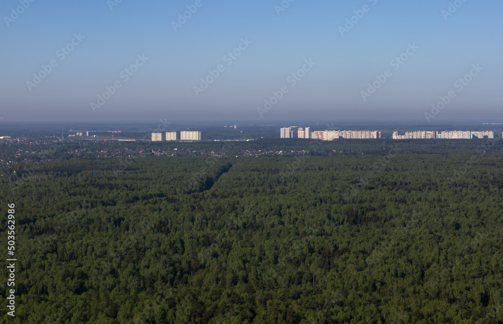 Fototapeta premium bird's eye view of the city forest and fields