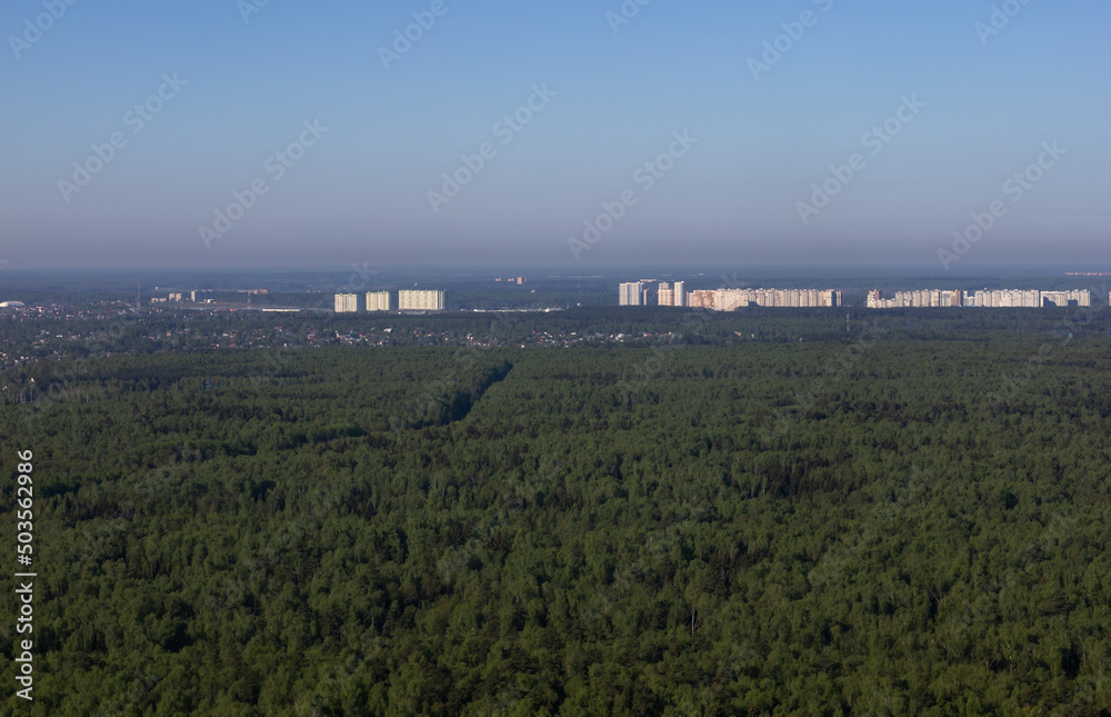 bird's eye view of the city forest and fields