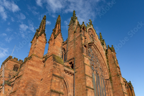 Carlisle Cathedral in the spring sunshine.  The second smallest of England's ancient cathedrals it was founded as an Augustinian priory and became a cathedral in 1133.  Carlisle, Cumbria, UK. photo