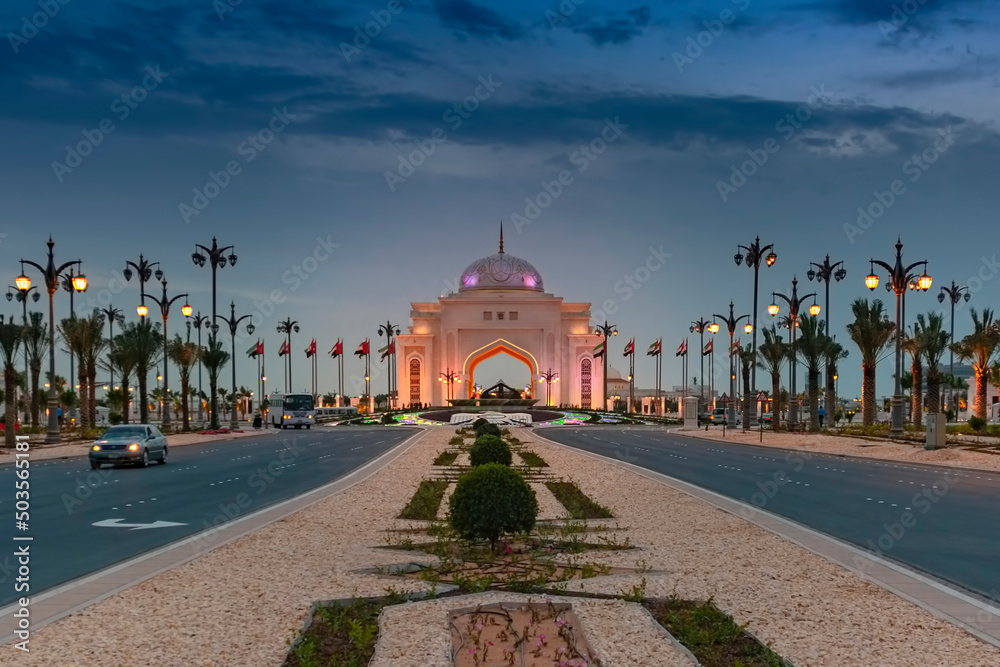 The illuminated entrance gate to the Presidential Palace in Abu Dhabi, United Arab Emirates during the Blue Hour 