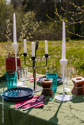 a table set in nature at the dacha in spring for lunch or dinner © Татьяна Лебедева