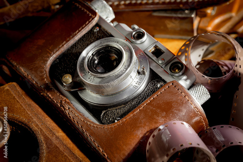 Old camera on wooden background