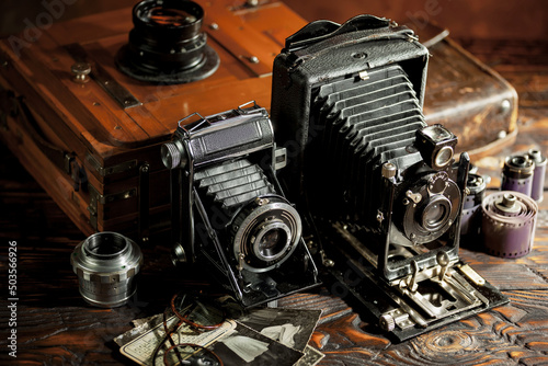 Old vintage cameras on an old background.