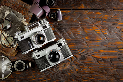 Old vintage cameras on an old background.