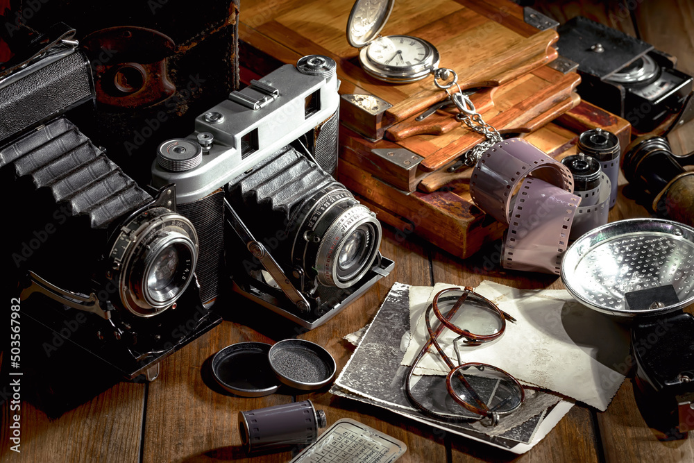 Old camera on wooden background