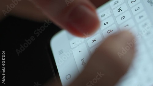 Female hands typing text on smartphone close-up photo