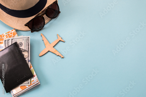 hat, sunglasses, airplane, passport, money and map, background for travel advertising, lettering, text, banner
