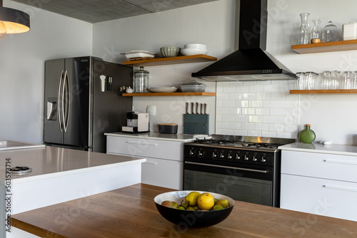 Fruits in bowl on kitchen island at modern home photo