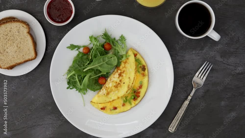 Serving a Cheese Omelette and Salad Serving a Cheese Omelette and Salad
