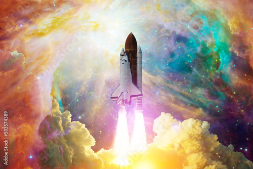 Fototapeta Naklejka Na Ścianę i Meble -  Spaceship flight. Space shuttle with smoke and blast takes off into the starry sky and clouds of gas or dust in space. Rocket starts into nebula. Concept. Elements of this image furnished by NASA.