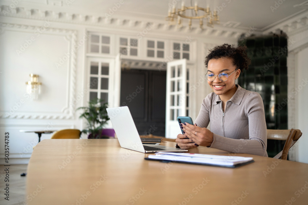 A smart woman with glasses is working in a new office, the company's online earnings report. A smart woman with glasses is working in a new office, the company's online earnings report.