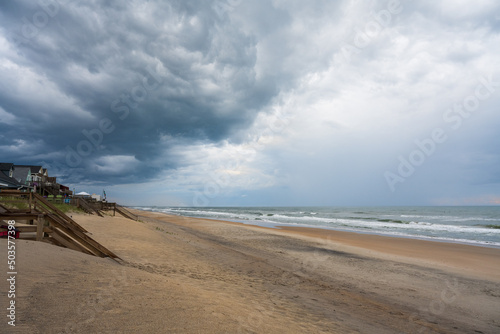 View down the beach as storm clouds move out