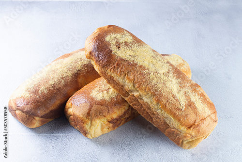 Corn and cheese bread, displayed on gray background