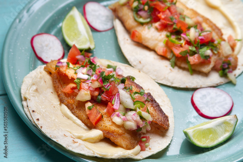 Fish tacos with fresh sauce and mayonnaise. Mexican food