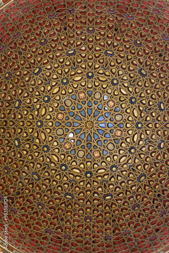 View on Mudejar style architectural details of ceiling in royal palace.. Old historical Andalusian town Seville  Spain.