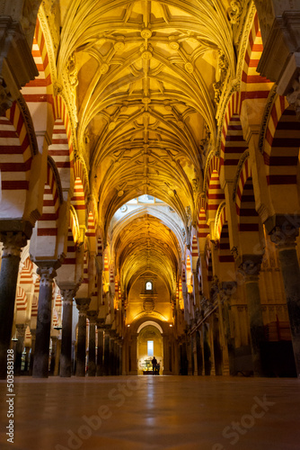 Medieval moorish architecture, colorful achways with columns in old mosque in Cordoba with no people, Andalusia, Spain photo