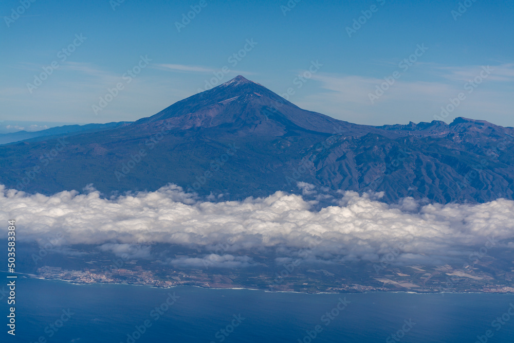 Flying propeller plane above Tenerife island with peak of Mount Teide, volcatic landscape, Canary islands, Spain