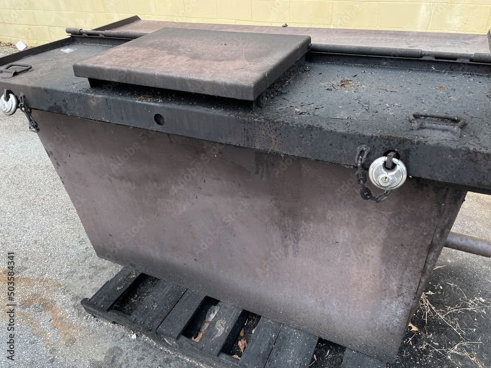 Locked Solid waste trash compactor corner view Locked Solid waste trash compactor corner view