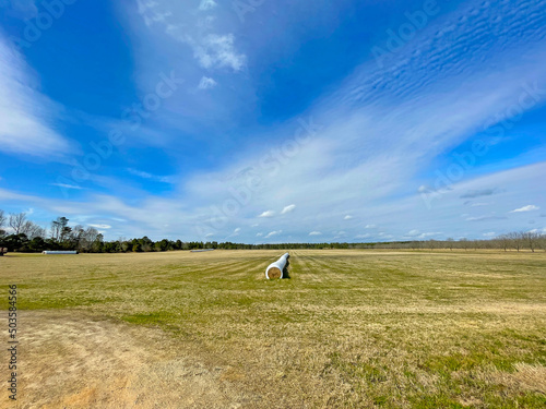 Open farm land in rural Georgia and blue sky background