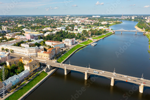 Picturesque summer landscape of Russian city of Tver overlooking two bridges across Volga river on sunny day ..