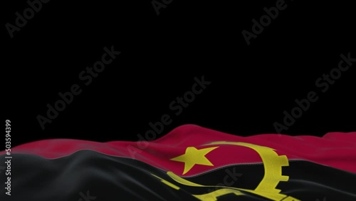 Angola fabric flag waving on the wind loop. Angolan embroidery stiched cloth banner swaying on the breeze. Half-filled black background. Place for text. 20 seconds loop. 4k photo