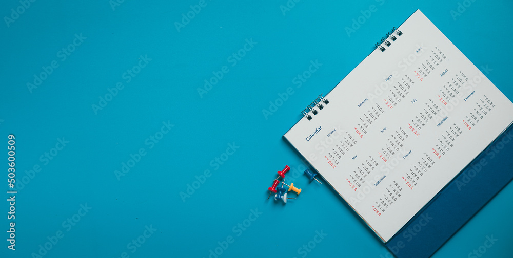 Close top view on white calendar 2022 month schedule Work planning and life concept. Close top view on white calendar 2022 month schedule Work planning and life concept.