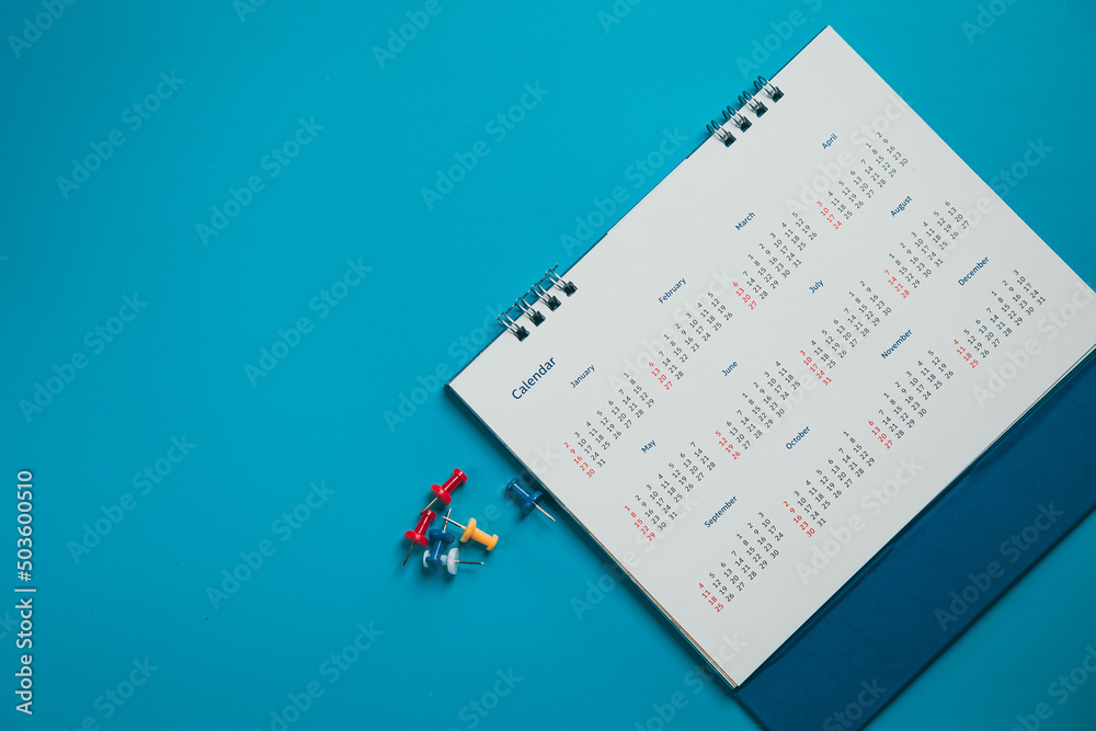Close top view on white calendar 2022 month schedule Work planning and life concept. Close top view on white calendar 2022 month schedule Work planning and life concept.