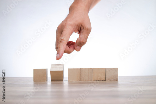 Hand pointing on the flip wooden blocks