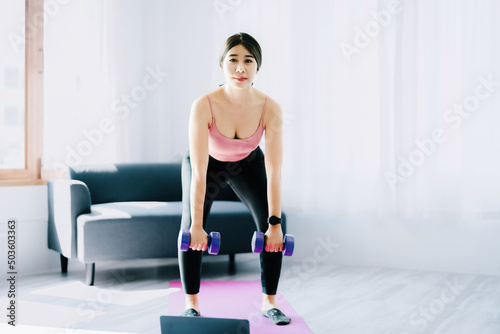 stress relief, , breathing exercises, meditation, portrait of Asian healthy woman lifting weights to strengthen her muscles after work.