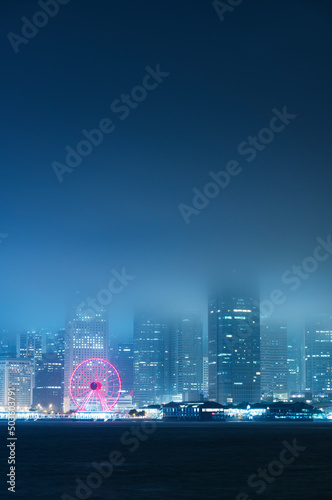 Wall Mural Victoria harbor of Hong Kong city in fog