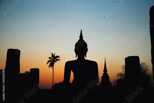 Wallpaper Mural Sunset at Wat Mahathat buddha and temple in Sukhothai Historical Park