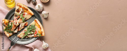 Plate with slices of tasty pizza on color background with space for text