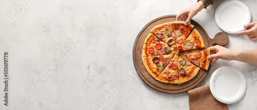 Obraz  z motywem Women taking pieces of tasty pizza on grunge background with space for text