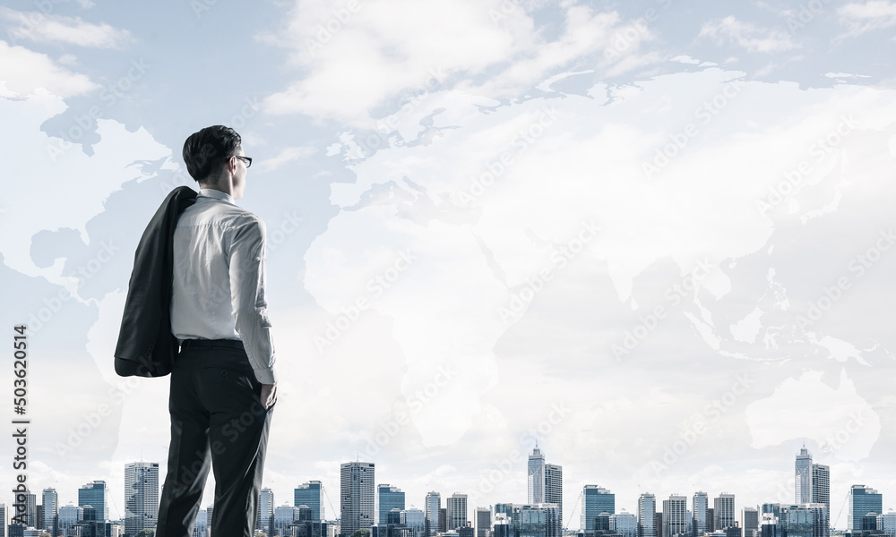 Concept of business success and control with confident boss against cityscape background Concept of business success and control with confident boss against cityscape background