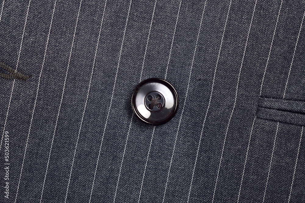 Top View of Button on Pinstripe Cloth Top View of Button on Pinstripe Cloth