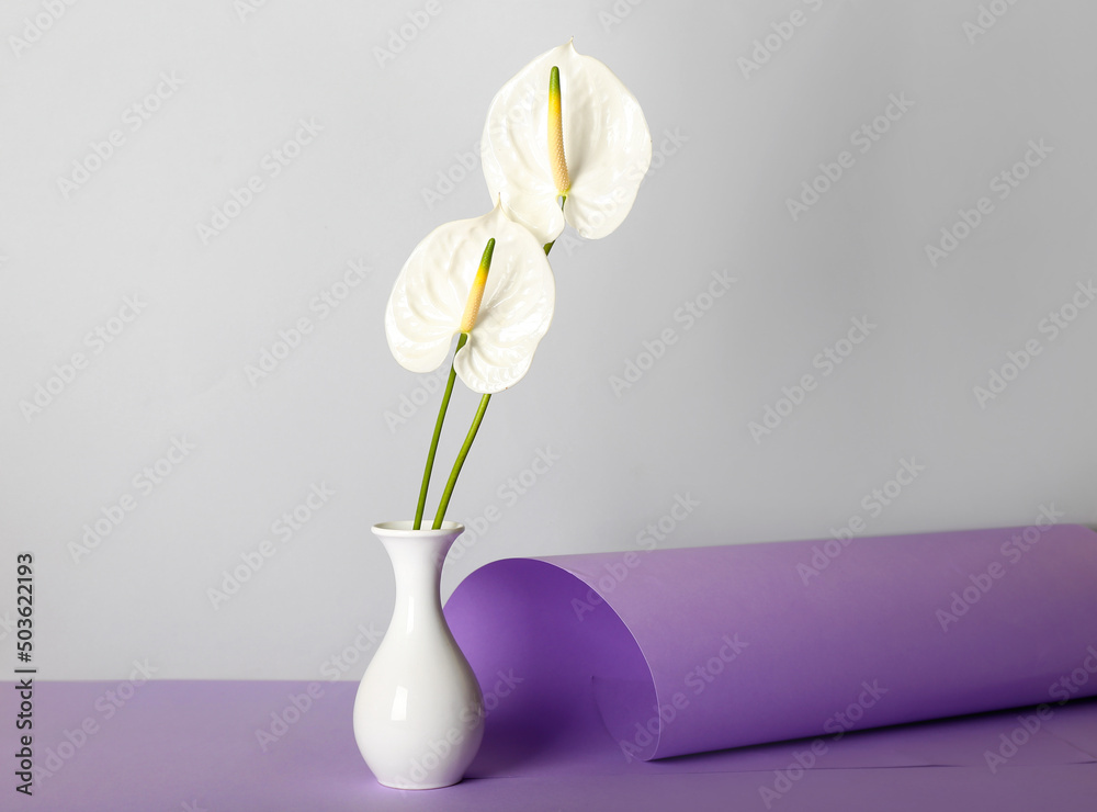 Vase with beautiful anthurium flowers on table Vase with beautiful anthurium flowers on table