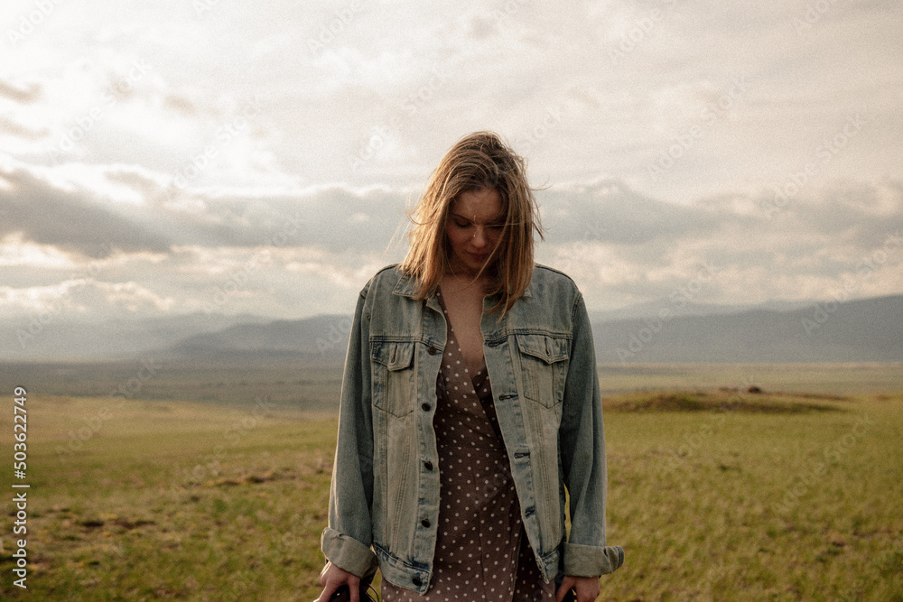 beautiful woman walking on field at sunset beautiful woman walking on field at sunset