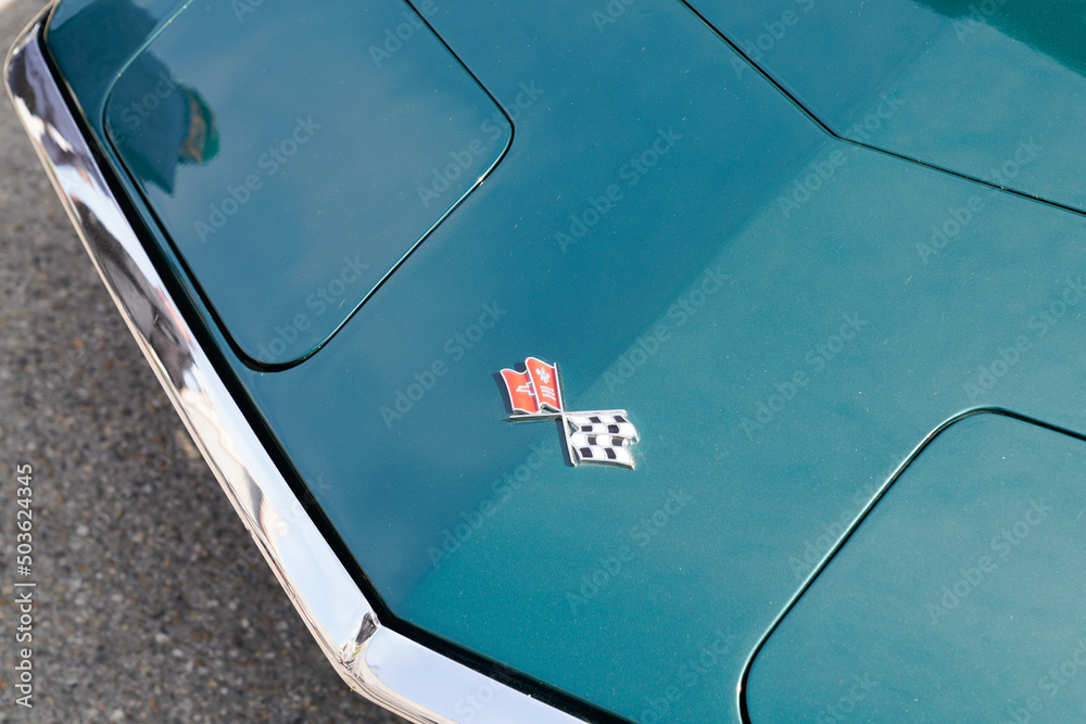 Chevrolet Corvette Car Sign logo and flag brand front of vintage racing ...
