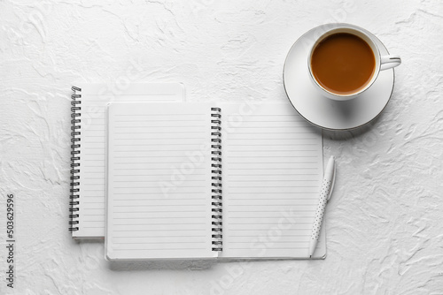 Notebooks, cup of coffee an...