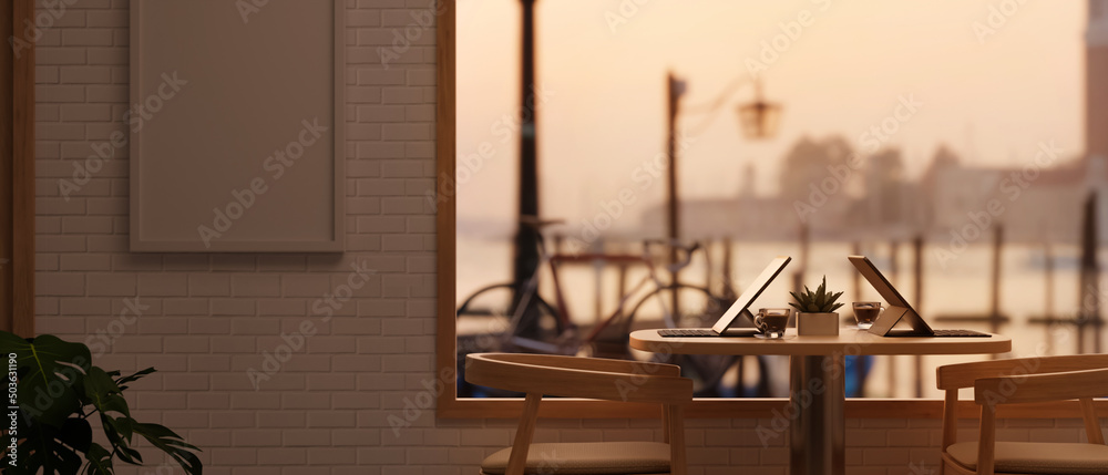 Comfortable restaurant or coffee shop interior seating area near window with the evening sunlight. - obrazy, fototapety, plakaty 