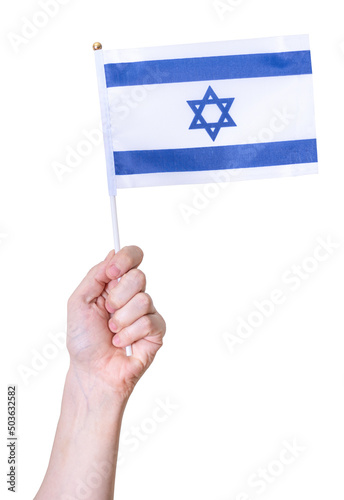 A hand holds the flag of Israel on a white isolated background. © beast01