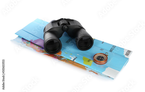 Modern binoculars, compass and map on white background