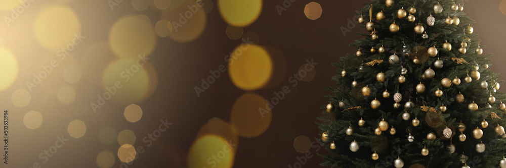 Beautifully decorated Christmas tree on brown background, space for text. Banner design