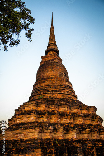 Wat Mahathat buddha and temple in Sukhothai Historical Park © pierrick