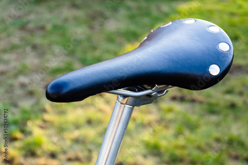 close up saddle and post of fixed gear bike, old vintage bicycle photo