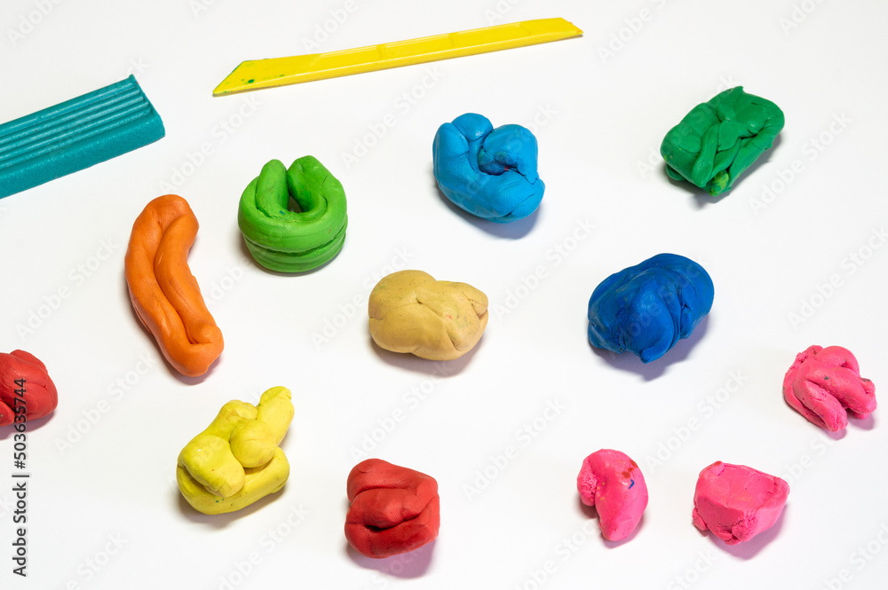 multicolored pieces of plasticine on the table multicolored pieces of plasticine on the table