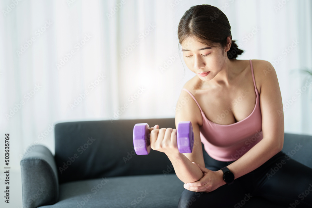 stress relief, , breathing exercises, meditation, portrait of Asian healthy woman lifting weights to strengthen her muscles after work.