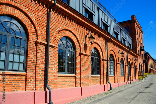 historic spinning mill factory built in 1872, after revitalization it houses modern loft apartments, Ksiezy Mlyn, Tymienieckiego street, Lodz, Poland, Europe