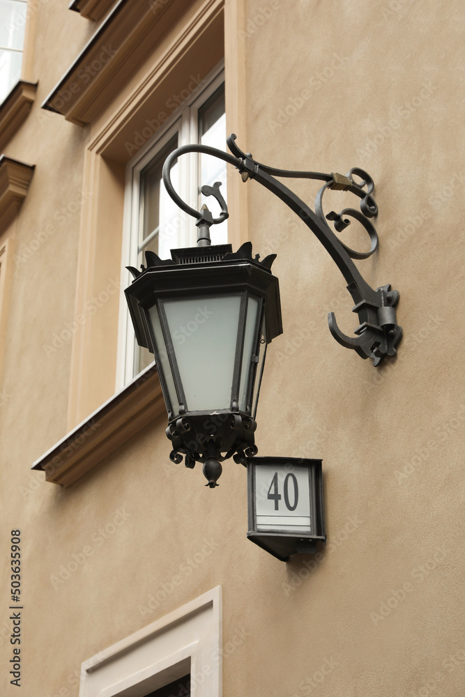 Vintage street lamp on wall of building